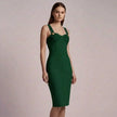 Woman wearing a green  NORVANE Riviera Bandage Dress against a plain background