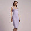 Woman wearing a lavender  NORVANE Riviera Bandage Dress against a plain background