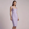Woman wearing a lavender  NORVANE Riviera Bandage Dress against a plain background