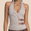 Light gray pinstripe halter top with a brown belt on a beige background