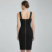 Black NORVANE Riviera Bandage Dress with a zipper detail on a gray background