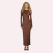 Woman wearing a brown long-sleeve dress on a white background
