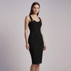 Woman wearing a black NORVANE Riviera Bandage Dress against a plain background