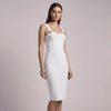 Woman wearing a white NORVANE  dress against a plain background