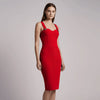 Woman wearing a red NORVANE Riviera Bandage Dress against a plain background