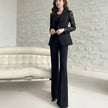 NORVANE black polyester blazer with lace sleeves and matching cropped trousers set.