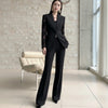 NORVANE black polyester blazer set with lace-panelled sleeves and matching cropped trousers.